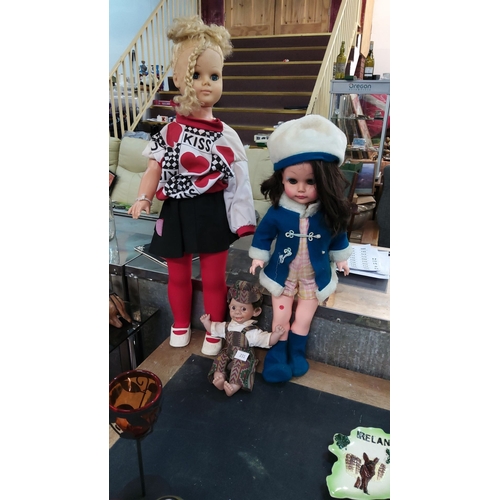 231 - Vintage doll collection featuring two large fashion dolls with period clothing and a smaller charact... 