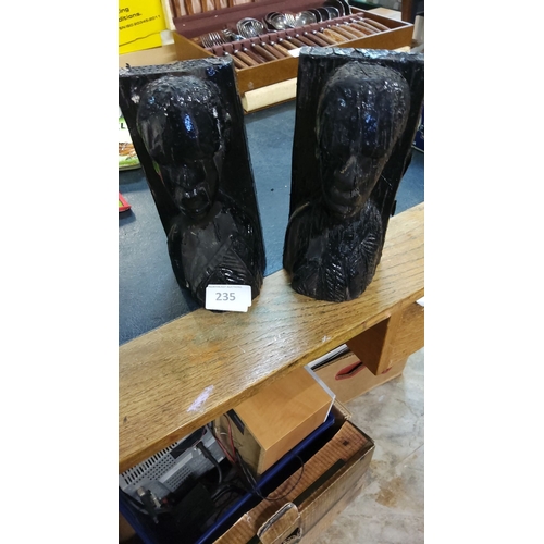 235 - Hand-carved wooden bust bookends with dark lacquered finish depicting expressive male figures in tra... 