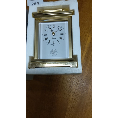 264 - Westclox quartz carriage clock in gold-tone finish, featuring Roman numerals and 