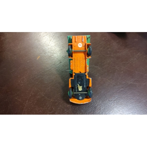 282 - Dinky Toys diecast Dodge tipper truck by Meccano, from the mid-20th century. Original orange and gre... 