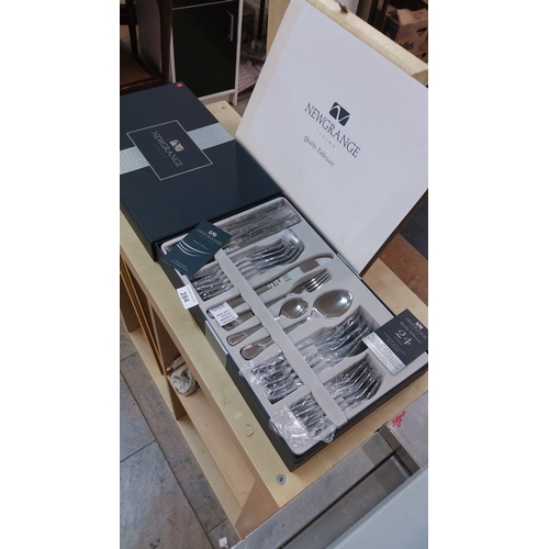 284 - Newgrange Living 24-piece stainless steel cutlery set in original presentation box. Unused and in pr... 