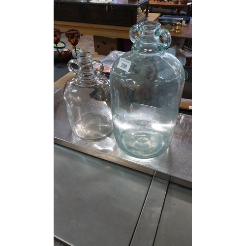 288 - Pair of vintage hand-blown glass demijohn bottles with applied handles. One has a light aqua tint.