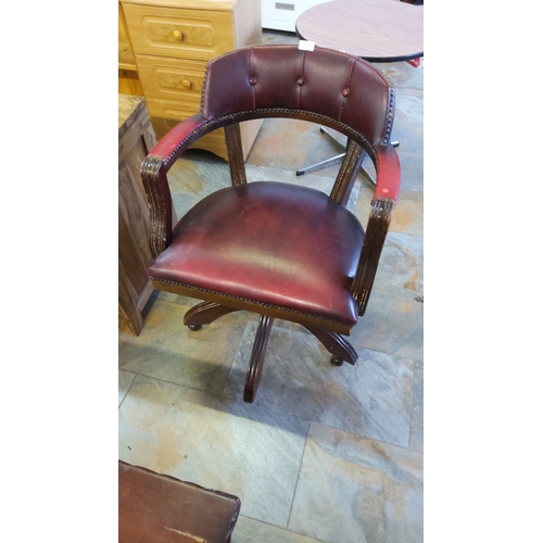 297 - Vintage burgundy leather swivel captain style desk chair with tufted back, brass nailhead trim, and ... 