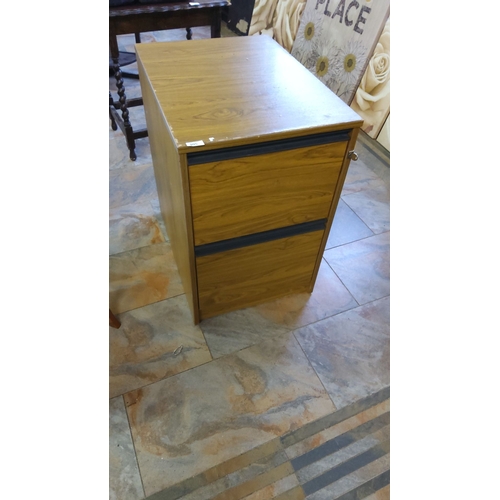 305 - Woodgrain laminate two-drawer filing cabinet with black trim and lock.