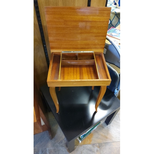 318 - Marquetry-inlaid sewing table with hinged lid, interior compartments, and cabriole legs. Wood with f... 