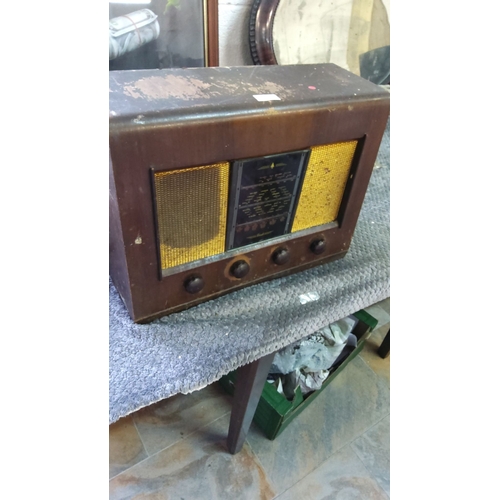 347 - Vintage wooden tabletop Bush radio, from the mid-20th century. It has a classic design with dual spe... 