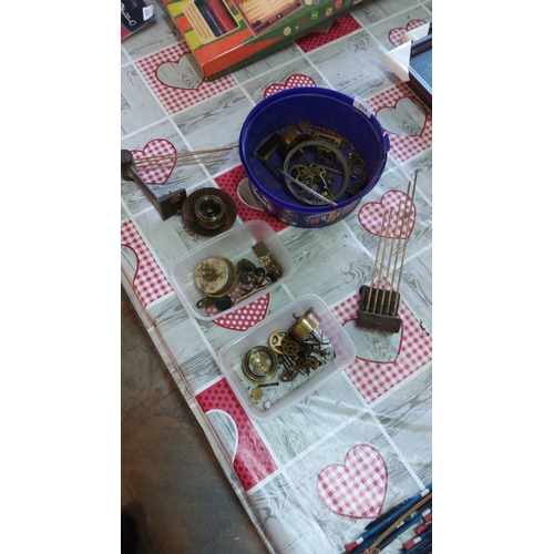 353 - Lot includes antique clock parts and mechanisms, such as brass gears, chime rods, and assorted compo... 