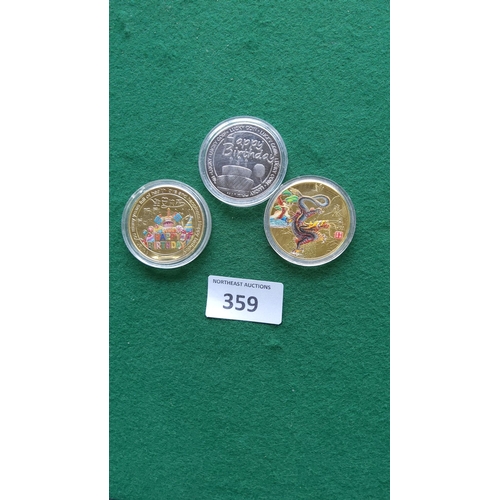 359 - Three commemorative coins, including a silver-tone 