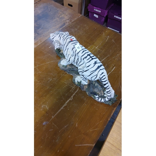 37 - Hand-painted white tiger figurine, detailed with naturalistic features, crafted from resin, mounted ... 