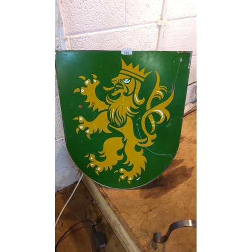 399 - Vintage heraldic shield sign features a crowned rampant lion in gold on a green background. The sign... 