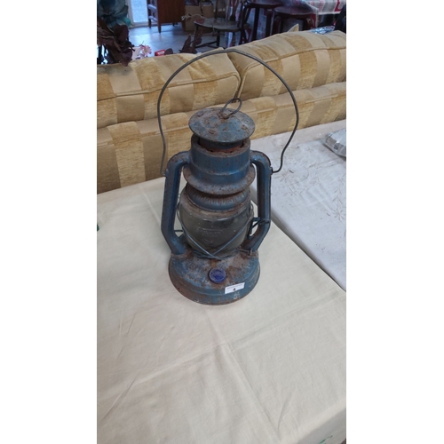 4 - Rustic vintage metal kerosene lantern with original glass globe has an aged patina.