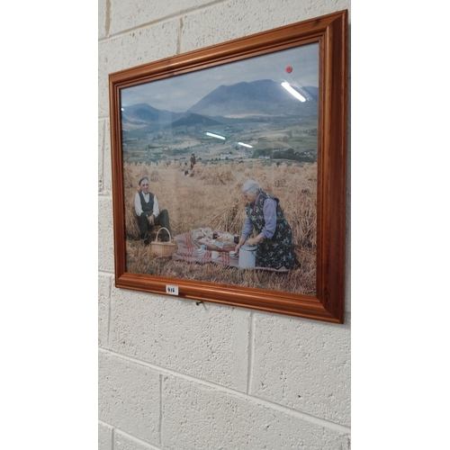 416 - Framed rural scene print depicting a traditional harvest-time picnic with elderly figures in a count... 