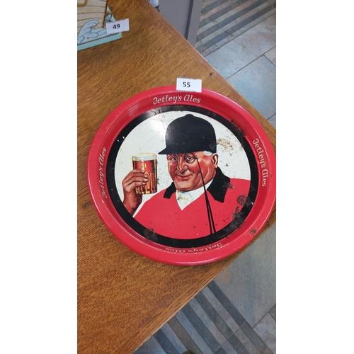 55 - Vintage Tetley's Ales advertising tin tray, mid-20th century. Features a bold red border with a char... 