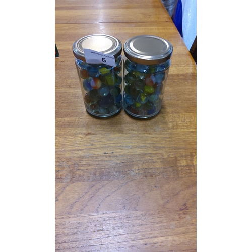 6 - Pair of glass jars filled with vintage multicolored marbles.