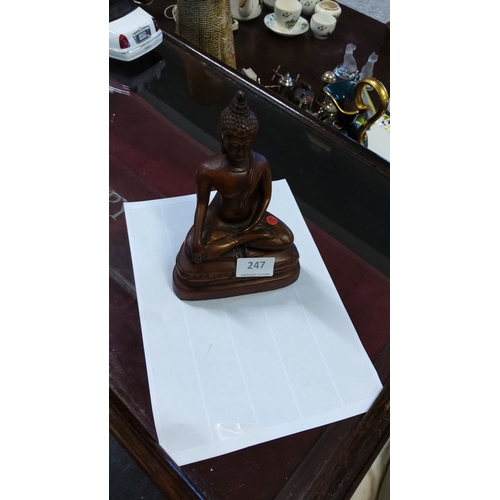 247 - Hand-carved wooden Buddha statue, seated in a meditative pose atop a lotus base. Features fine detai... 