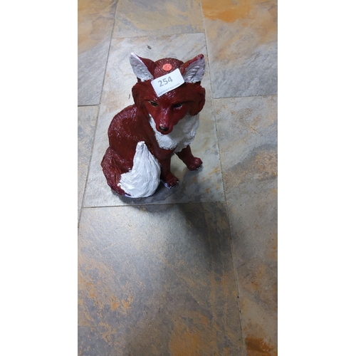 254 - Large Hand-painted fox figurine, cast from resin, featuring rich red and white detailing.