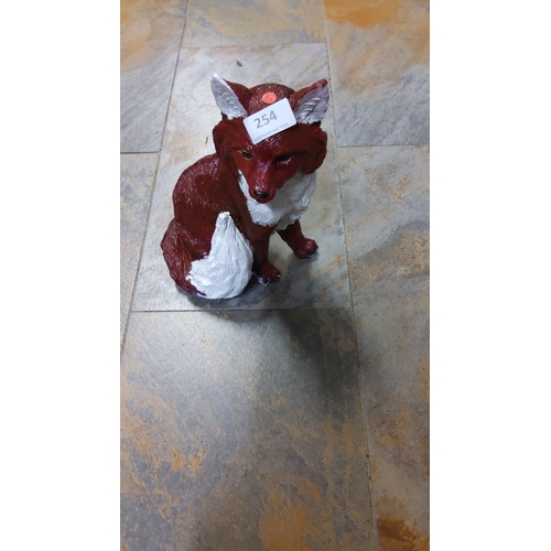 254 - Large Hand-painted fox figurine, cast from resin, featuring rich red and white detailing.