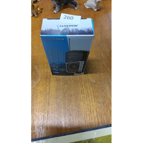 260 - Lloytron AM/FM Sports Radio, new in box. Compact two-band portable radio with earphone support. Batt... 