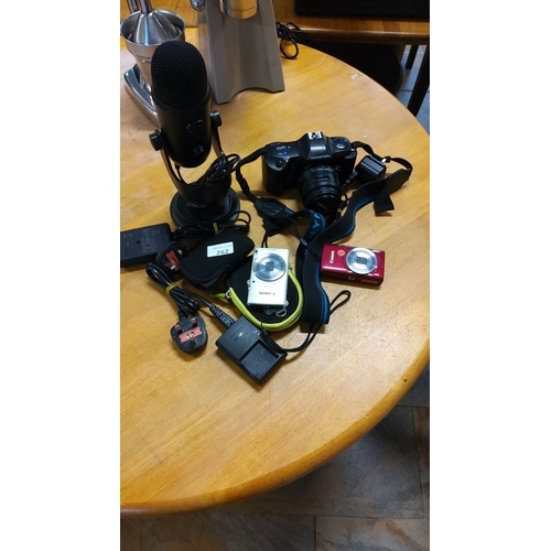 262 - Mixed lot,including an Olympus digital camera, two Canon compact cameras, a Blue Yeti USB microphone... 