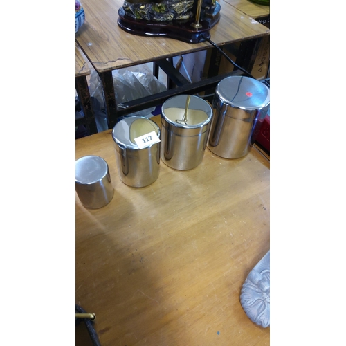 117 - Set of four vintage stainless steel canisters with fitted lids, one featuring an internal mixing too... 