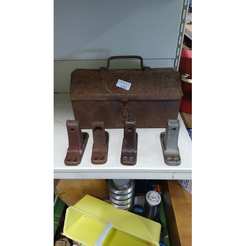 132 - Metal toolbox with handle and latch, accompanied by four cast iron mounting brackets.