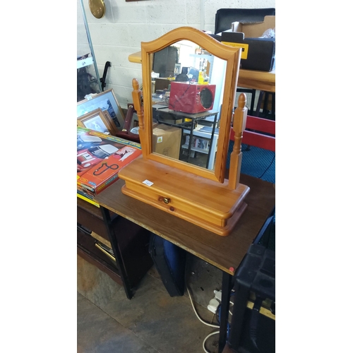 147 - Vintage wooden tabletop vanity mirror with a single drawer, an arched frame, swivel mirror, and turn... 