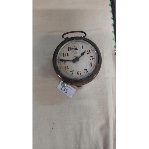 155 - Early 20th-century French brass maritime-style alarm clock by Conquest. Features a dial, bold numera... 