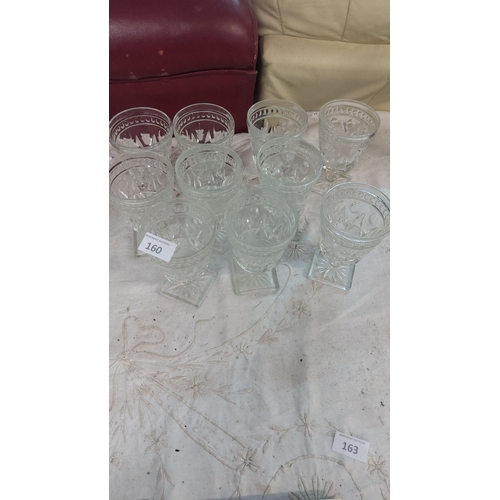 160 - Set of eight vintage pressed glass goblets with intricate cut patterns and square bases.