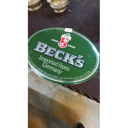 177 - Vintage Beck’s Beer advertising tin sign featuring classic green and red branding.