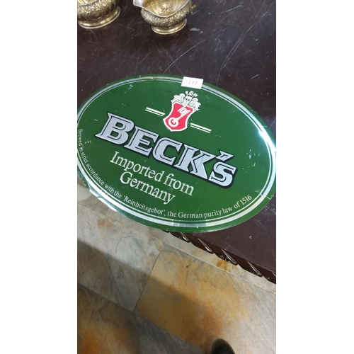 177 - Vintage Beck’s Beer advertising tin sign featuring classic green and red branding.