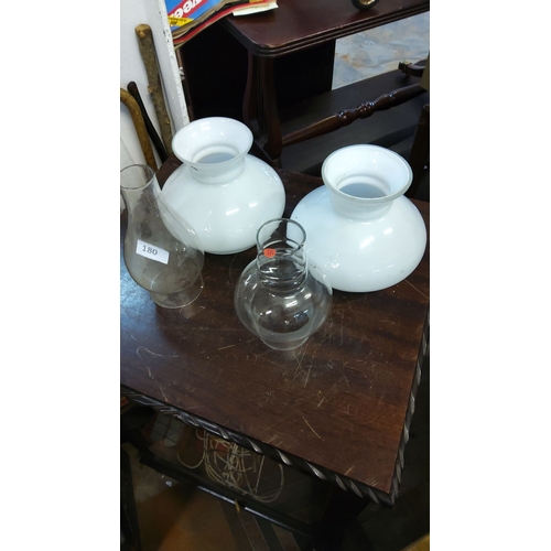 180 - Four vintage glass lamp shades, including two milk white and two clear glass chimney-style shades.