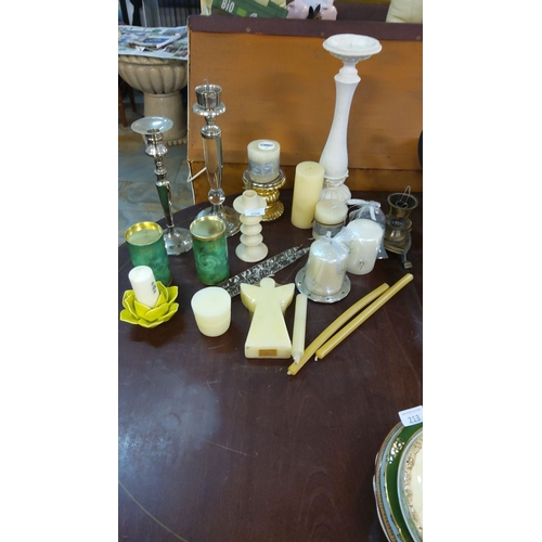 208 - Mixed lot of decorative candle holders and candles, including silver-plated, ceramic, and glass piec... 