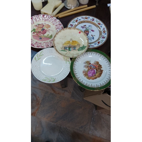 213 - Assorted vintage decorative porcelain plates feature floral motifs, embossed textures, gold accents,... 