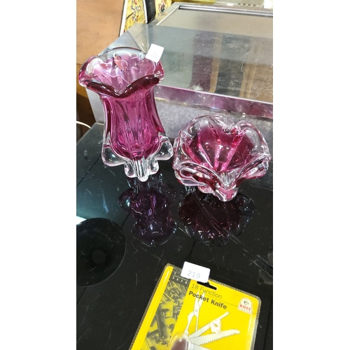 216 - Pair of hand-blown cranberry glass vases with clear bases, featuring flared and ruffled designs. Mid... 