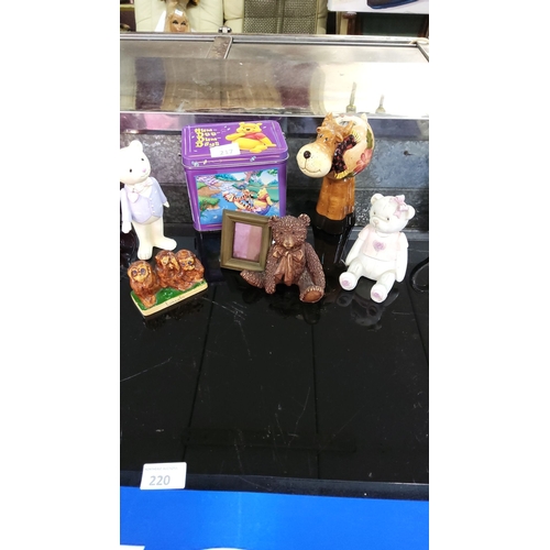 217 - Mixed lot featuring porcelain and resin teddy bear figurines, a decorative reindeer pitcher, a 