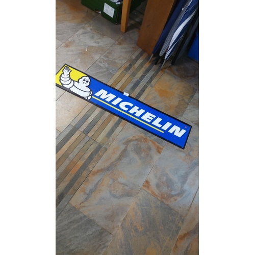 220 - Vintage Michelin modern sign features the iconic Bibendum logo. It has a bold blue and yellow design... 