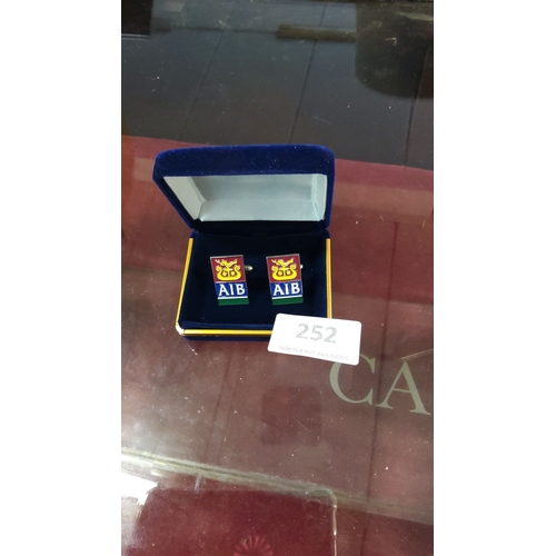 252 - Allied Irish Banks (AIB) enamel cufflinks in presentation box, detailed with vibrant enamel finish.