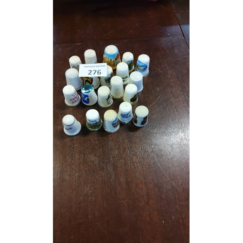 276 - Lot of 20 collectible ceramic thimbles featuring various travel and souvenir designs. Some pieces ha... 