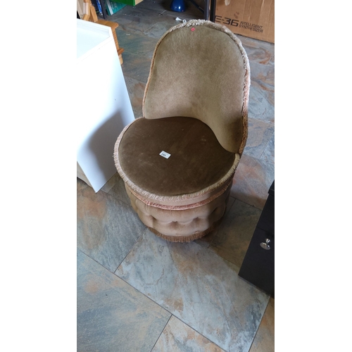 285 - Vintage velvet vanity chair with fringed trim and tufted base. Features a mid-century design.