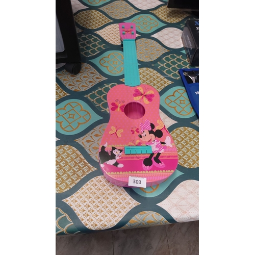 303 - Minnie Mouse-themed toy guitar, featuring a vibrant pink design with character illustrations. Lightw... 