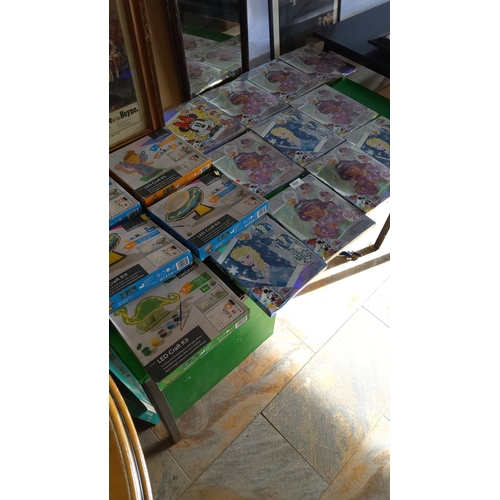 319 - Mixed lot of sealed craft kits and 100-piece Disney-themed puzzles. Includes LED painting kits and p... 