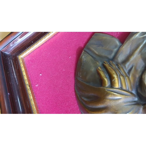 322 - Framed bronze relief of the Virgin Mary, signed by the artist, mounted on a red velvet background wi... 