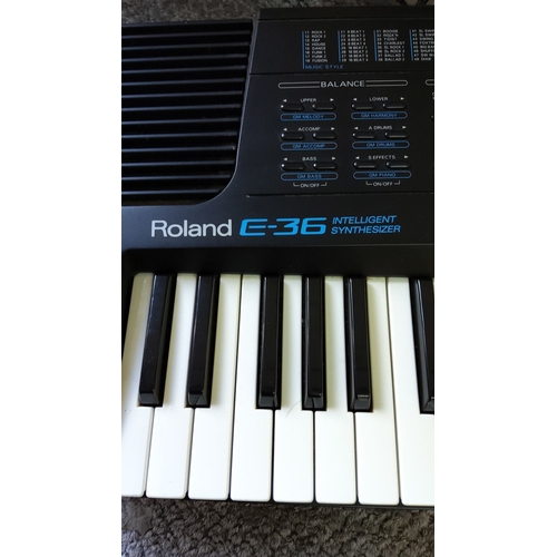 329 - Roland E-36 Intelligent Synthesizer, 1990s. Classic 61-key arranger keyboard with vintage sounds and... 