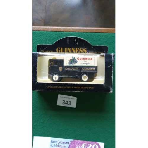 343 - Lledo Guinness die-cast model truck in original packaging. Features vintage 