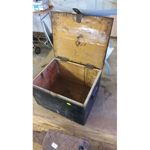 376 - Early 20th-century black-painted wooden storage chest with metal hardware. It has a hinged lid and l... 