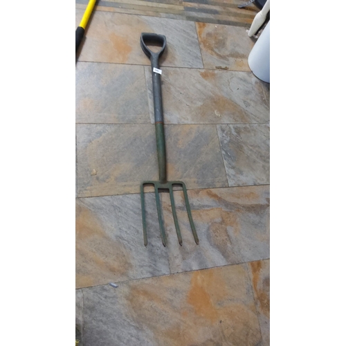 380 - Vintage four-tine garden fork with a sturdy metal head and D-handle grip.