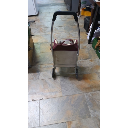 386 - Vintage folding shopping trolley with sturdy metal frame and dual wheels. Includes a cream and burgu... 