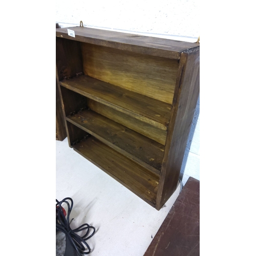 401 - Rustic wooden wall-mounted bookshelf with three shelves.