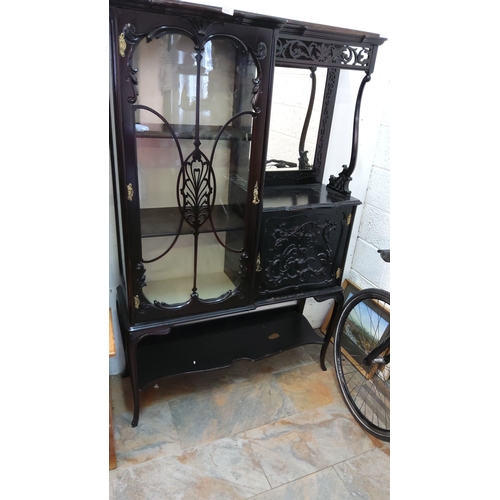 415 - Early 20th-century mahogany display cabinet with ornate carved detailing, glazed door, mirrored back... 