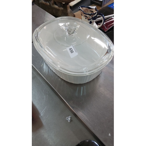 430 - Vintage CorningWare oval casserole dish with glass lid. Classic white ribbed design.